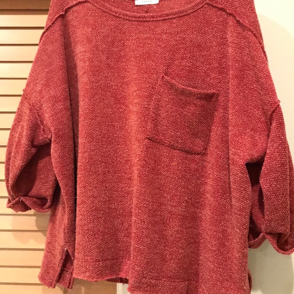 Beautiful red sweater. Short but roomie.